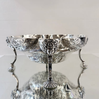 A PAIR OF LATE VICTORIAN REPOUSSÉ STERLING SILVER CENTERPIECES, LONDON, 1889