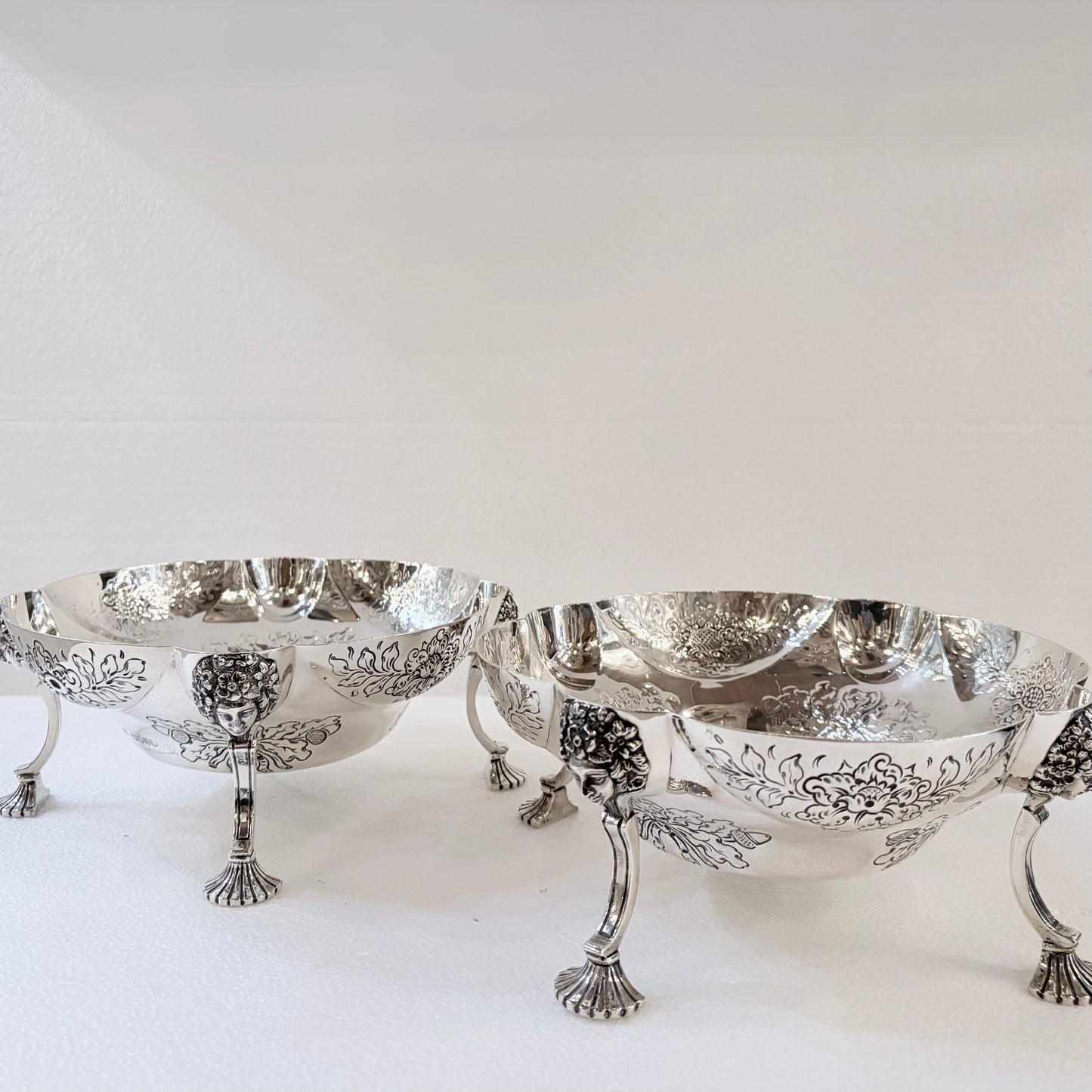 A PAIR OF LATE VICTORIAN REPOUSSÉ STERLING SILVER CENTERPIECES, LONDON, 1889
