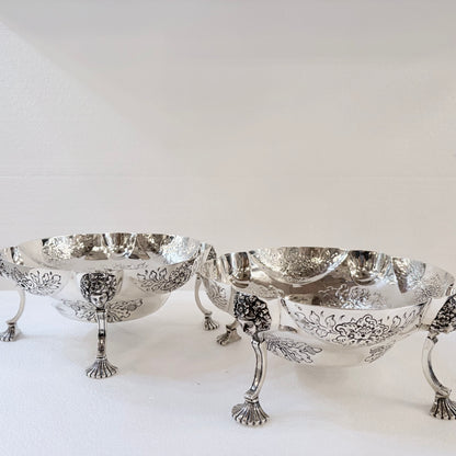 A PAIR OF LATE VICTORIAN REPOUSSÉ STERLING SILVER CENTERPIECES, LONDON, 1889