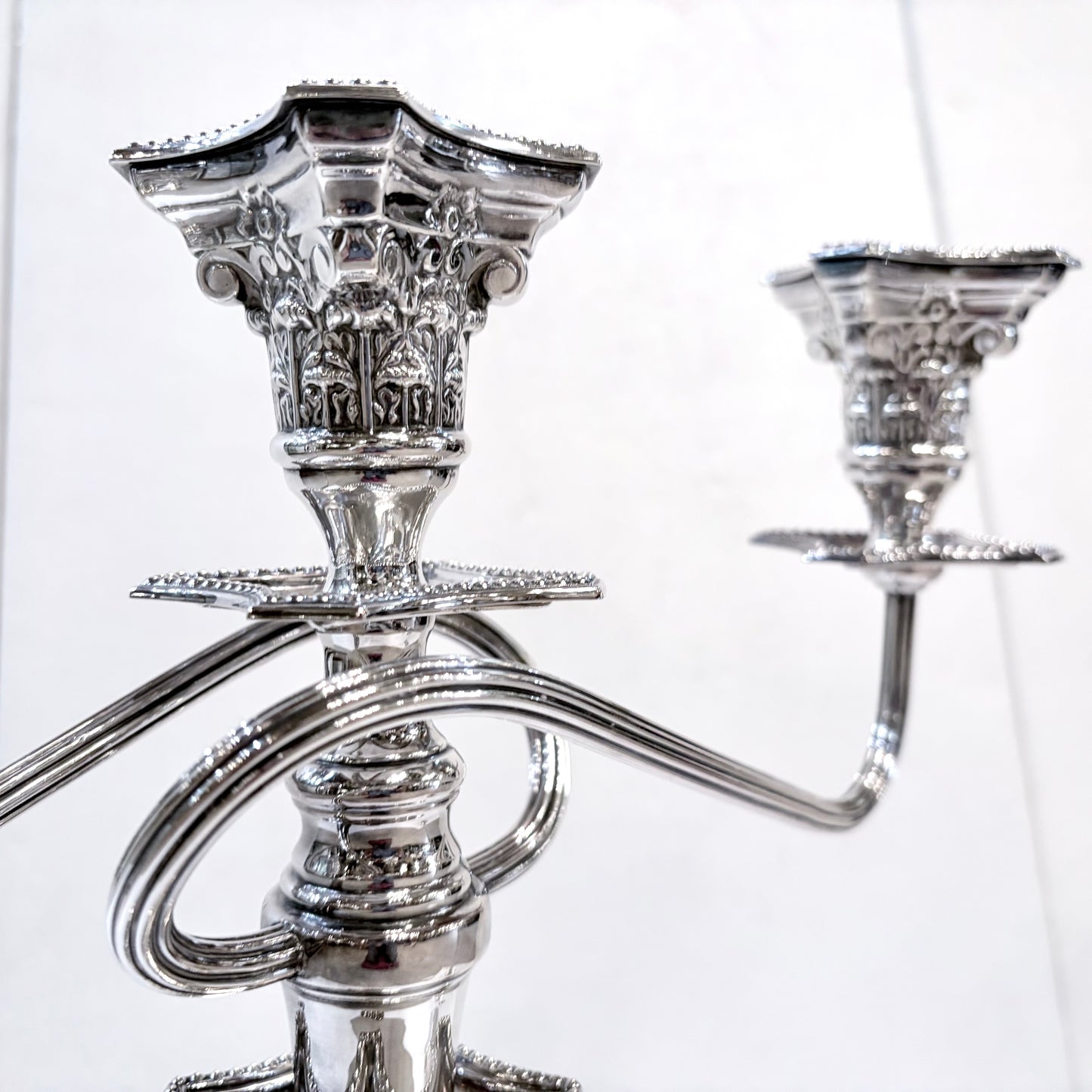 A PAIR OF GEORGE III STYLE CORINTHIAN COLUMN THREE-LIGHT CANDLESTICKS, ENGLISH, 1890