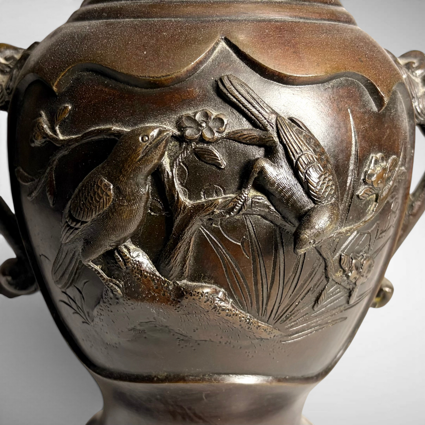PAIR OF MEIJI PERIOD RELIEF-CAST BRONZE VASES, JAPAN, C.1870–1900
