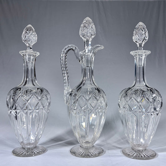 A TRIPLE-SUITE OF CUT-GLASS DECANTERS AND CLARET JUG, WEST EUROPE, 19th CENTURY