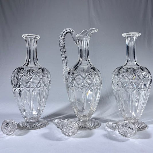 A TRIPLE-SUITE OF CUT-GLASS DECANTERS AND CLARET JUG, WEST EUROPE, 19th CENTURY