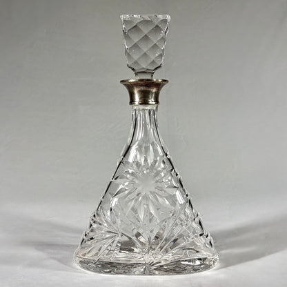 TRIANGULAR CUT-GLASS AND STERLING SILVER-MOUNTED DECANTER, LONDON, 1968