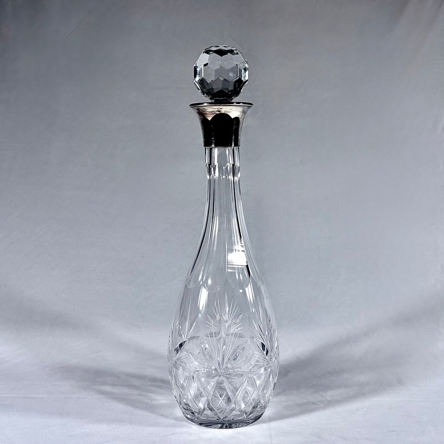 LARGE TEARDROP-SHAPED SILVER-MOUNTED CUT CRYSTAL DECANTER
