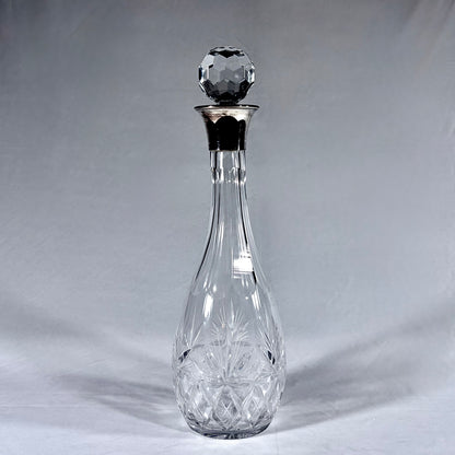 LARGE TEARDROP-SHAPED SILVER-MOUNTED CUT CRYSTAL DECANTER