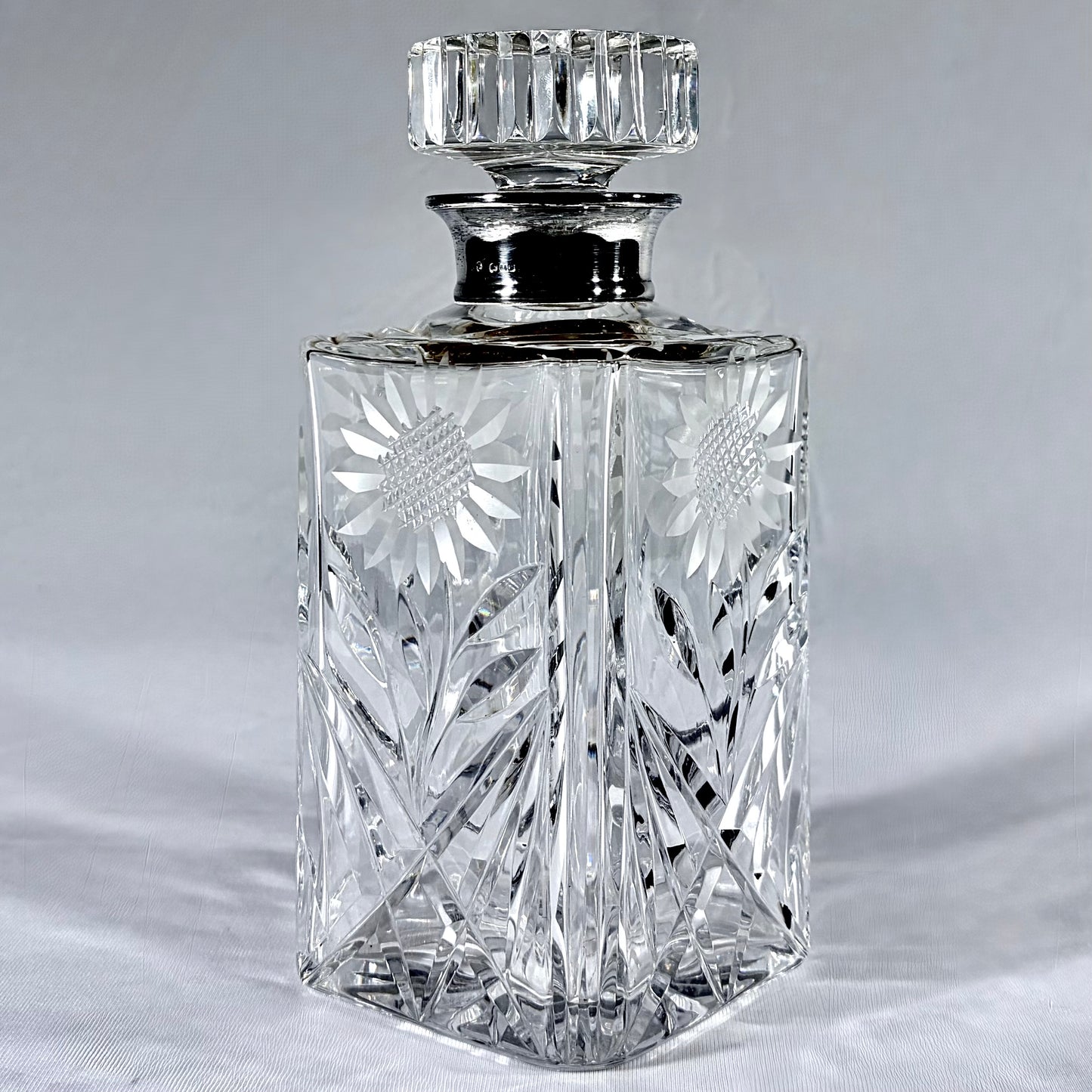 MID-CENTURY CUT-GLASS AND SILVER MOUNTED DECANTER, LONDON, c. 1930s - 1950s