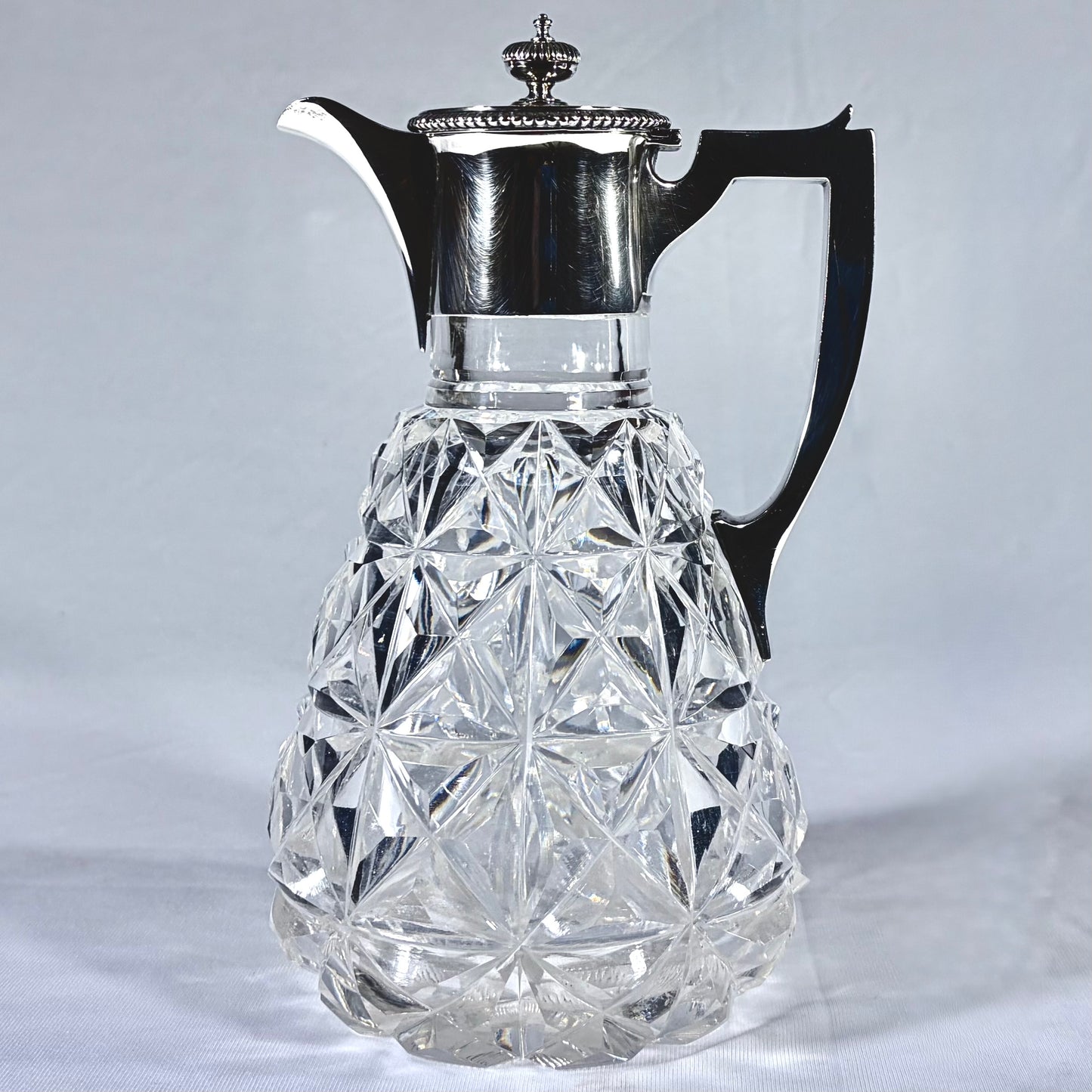 EDWARDIAN DIAMOND-POINT CUT LEAD CRYSTAL AND STERLING SILVER CLARET JUG, LONDON, 1902