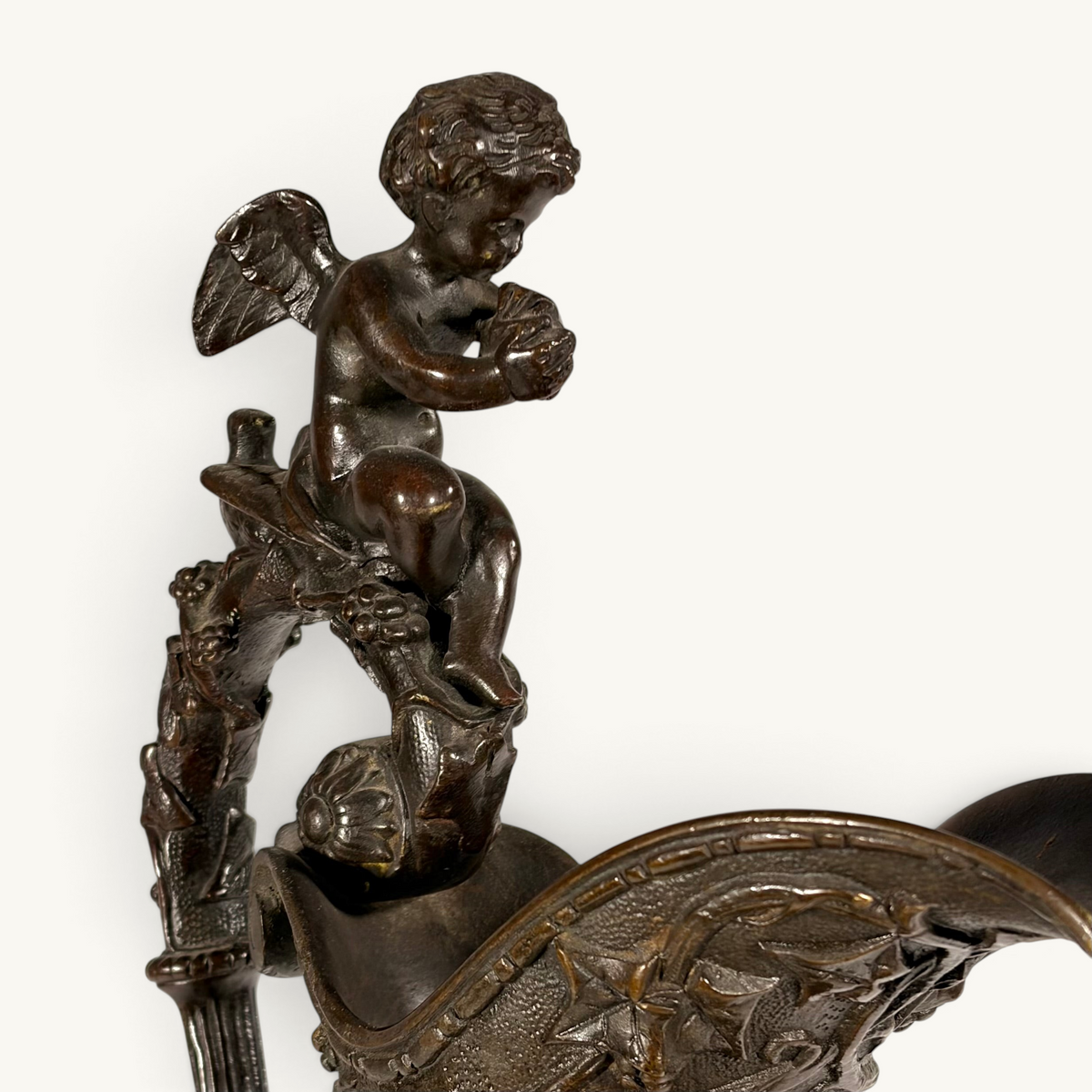 KLS Vaults 19th century bronze ewer featuring a winged cherub finial on a decorative handle with chocolate-brown patina
