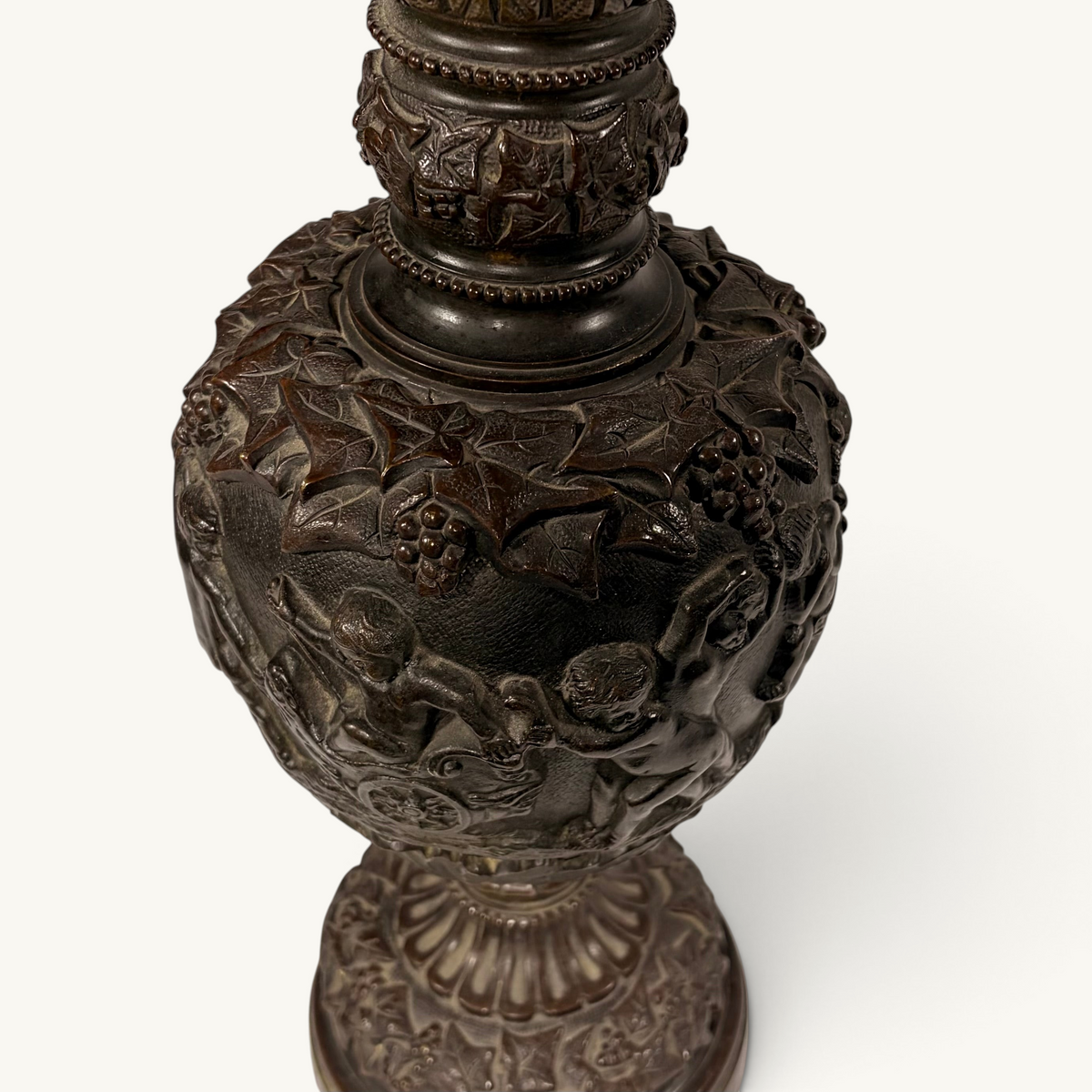 KLS Vaults neoclassical bronze ewer with high-relief putti frieze, grapevine motifs, and rich chocolate-brown patina.