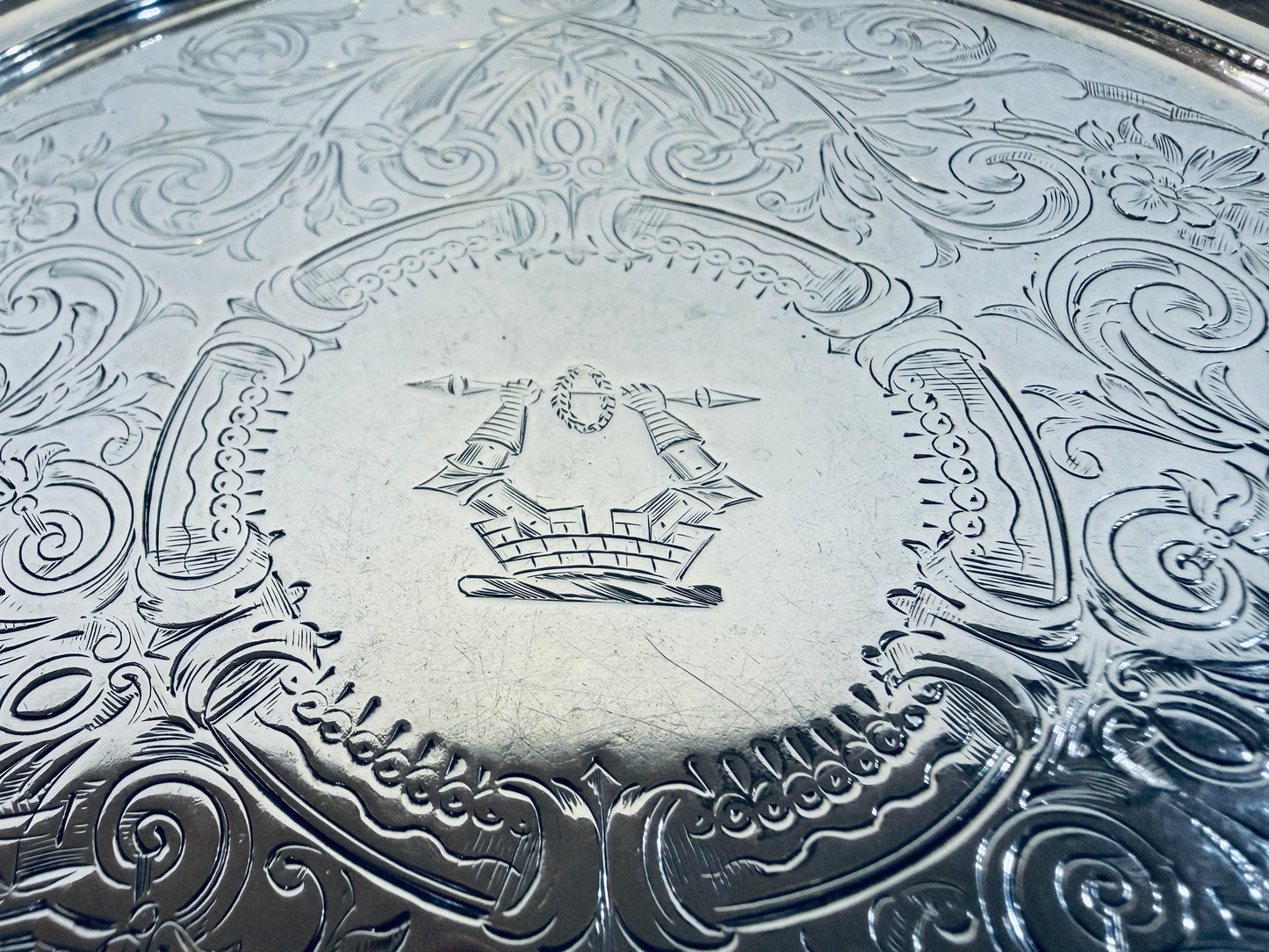 A SMALL VICTORIAN CHASED STERLING SILVER SALVER, LONDON, 1876