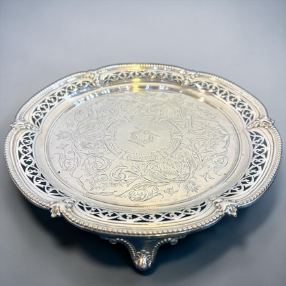 A SMALL VICTORIAN CHASED STERLING SILVER SALVER, LONDON, 1876