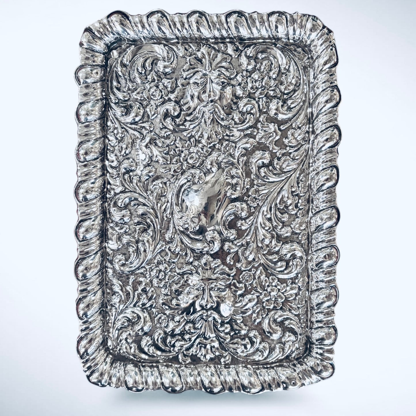 A GEORGE V STERLING SILVER REPOUSSÉ DRESSING TRAY, BIRMINGHAM, 1927