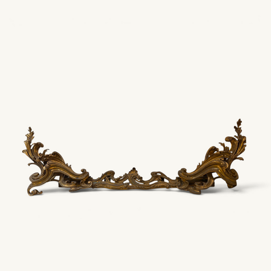 KLS Vaults Louis XV style gilded bronze fireplace fender with intricate Rococo acanthus leaf and C-scroll detailing.