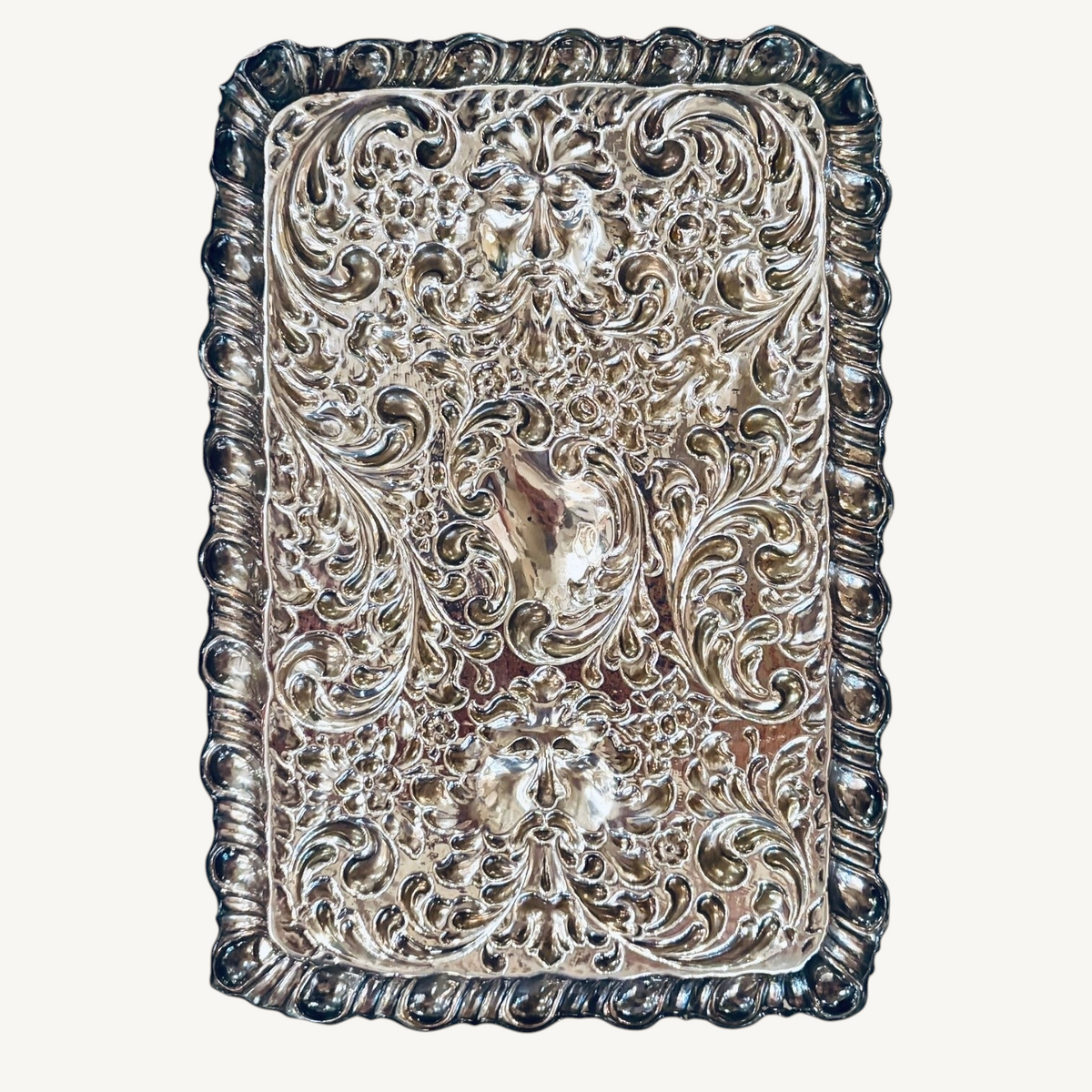 KLS Vaults 1927 George V sterling silver dressing tray with intricate repoussé floral, scroll, and Green Man mask motifs.