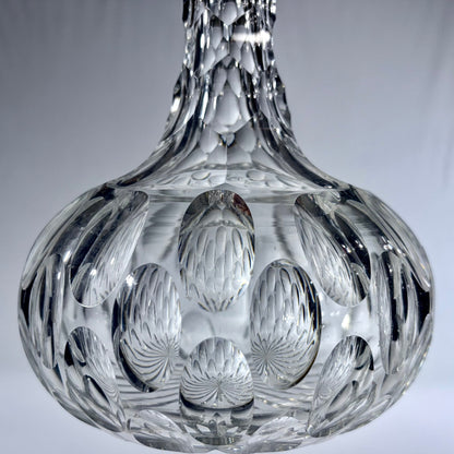 KLS Vaults mid-century Bohemian lead crystal spirit decanter with deep-cut oval thumbprint patterns and faceted neck.