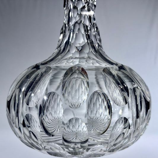 KLS Vaults mid-century Bohemian lead crystal spirit decanter with deep-cut oval thumbprint patterns and faceted neck.