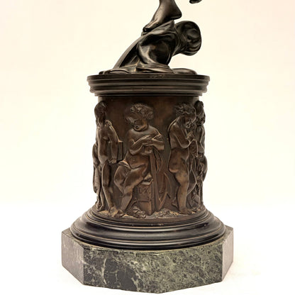 KLS Vaults neoclassical patinated bronze Atropos figure on a relief-cast pedestal with putti and marble plinth