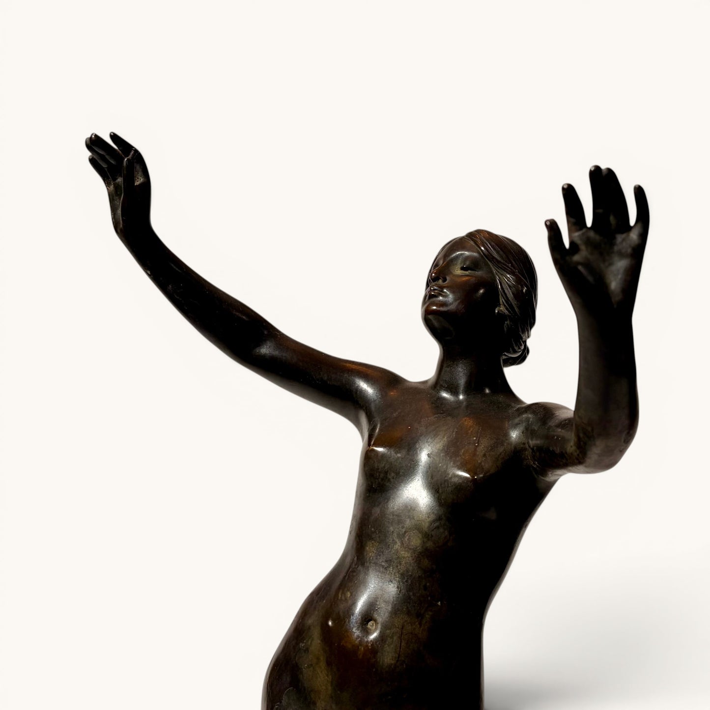 KLS Vaults late Victorian patinated bronze figure of a female nude dancer, c. 1898, after Frederick Schlipf, in dynamic pose with arms outstretched.