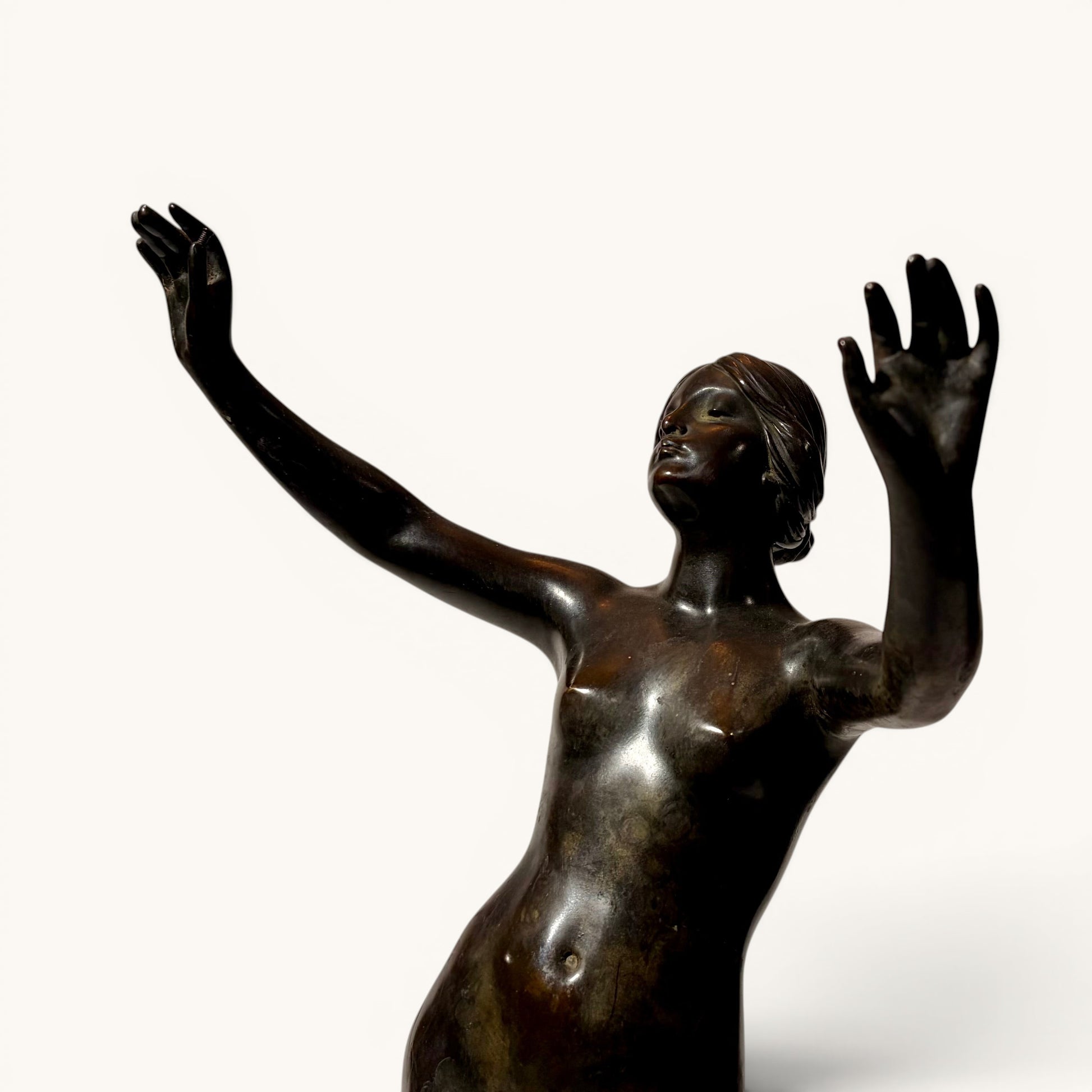 KLS Vaults late Victorian patinated bronze figure of a female nude dancer, c. 1898, after Frederick Schlipf, in dynamic pose with arms outstretched.