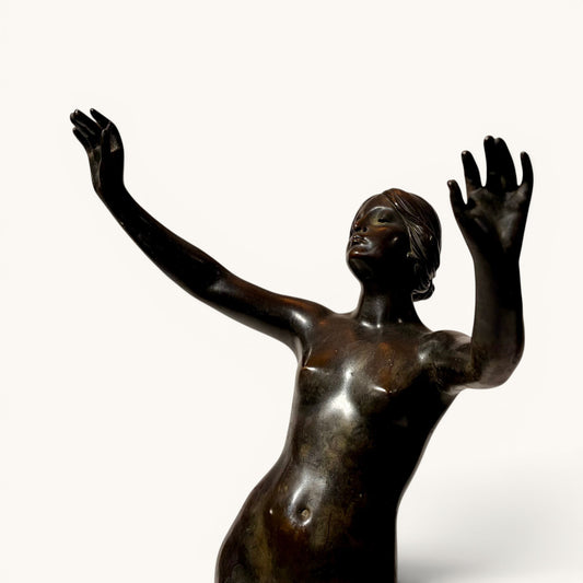KLS Vaults late Victorian patinated bronze figure of a female nude dancer, c. 1898, after Frederick Schlipf, in dynamic pose with arms outstretched.