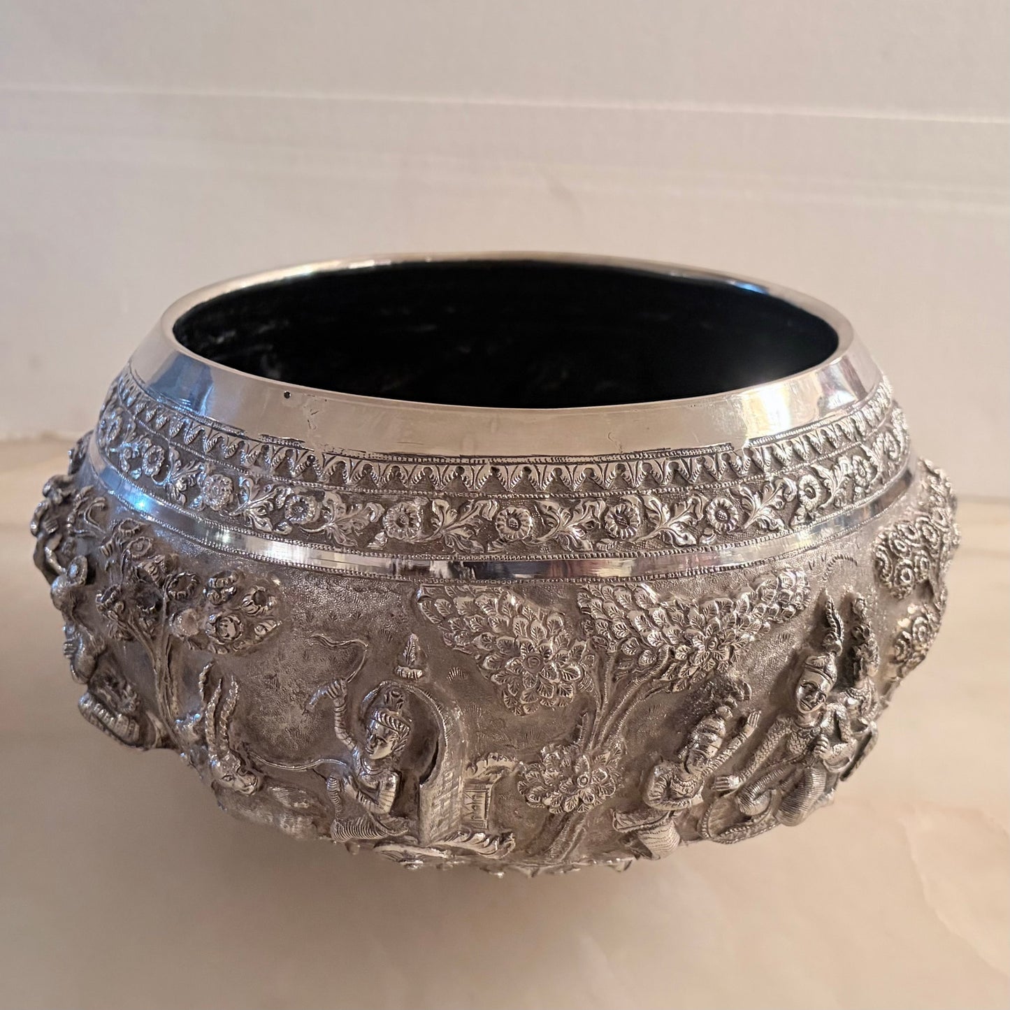 KLS Vaults 19th-century Burmese silver thabeik bowl featuring intricate high-relief Ramayana repoussé scenes.