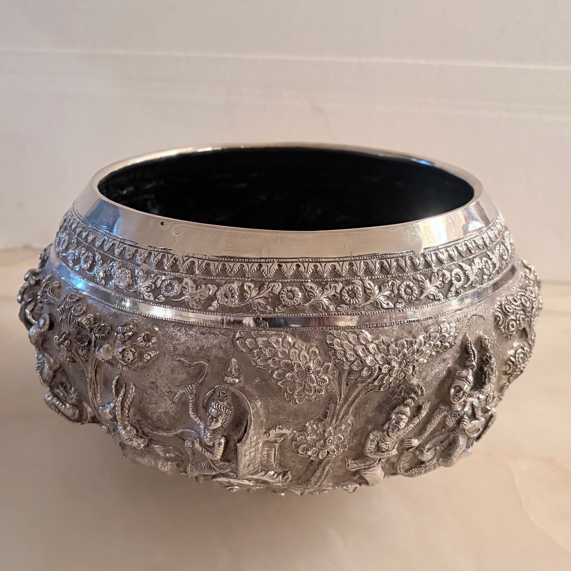 KLS Vaults 19th-century Burmese silver thabeik bowl featuring intricate high-relief Ramayana repoussé scenes.