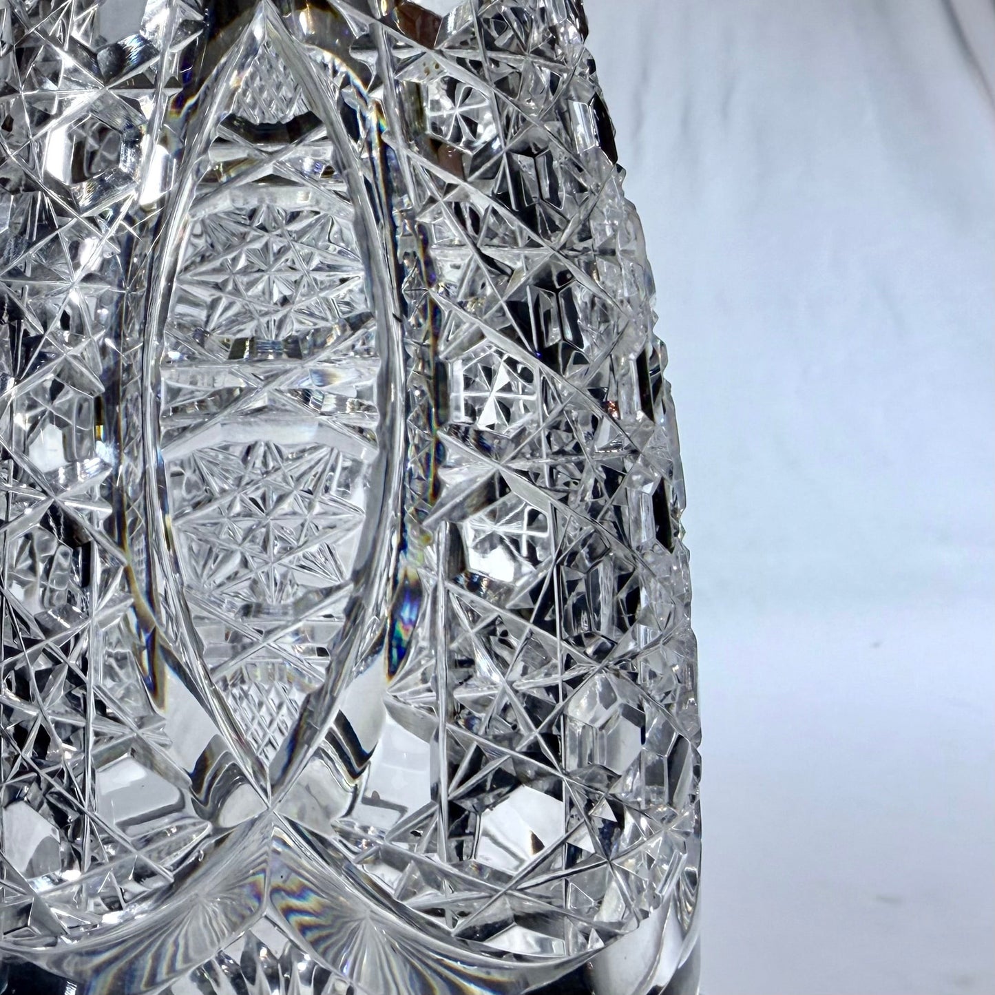 KLS Vaults 1920 crystal decanter featuring intricate hobnail and star-cut geometric patterns on clear glass.