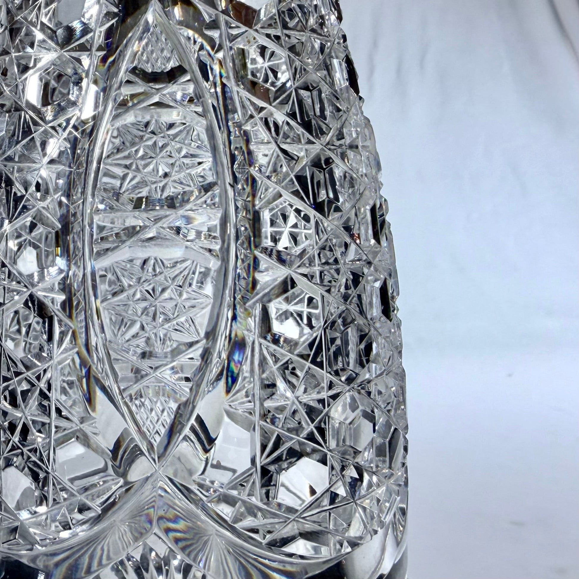 KLS Vaults 1920 crystal decanter featuring intricate hobnail and star-cut geometric patterns on clear glass.