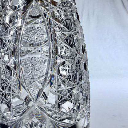 KLS Vaults 1920 crystal decanter featuring intricate hobnail and star-cut geometric patterns on clear glass.