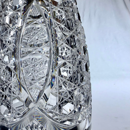KLS Vaults 1920 crystal decanter featuring intricate hobnail and star-cut geometric patterns on clear glass.