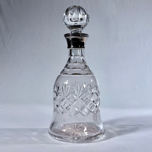 KLS Vaults bell-shaped lead crystal decanter with diamond-cut patterns and a polished sterling silver collar.