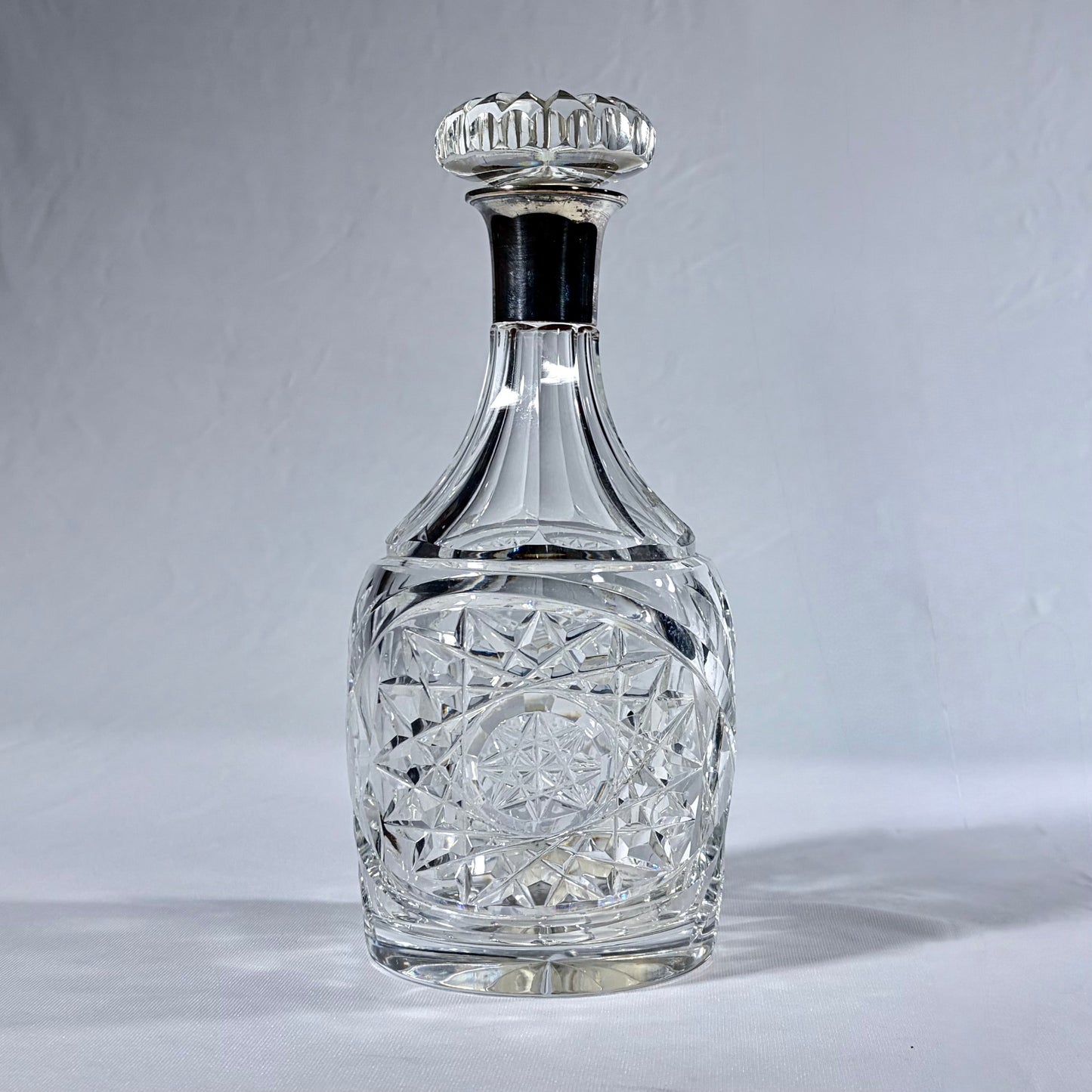 KLS Vaults 1936 George VI cut crystal decanter with sterling silver collar and intricate geometric diamond patterns.