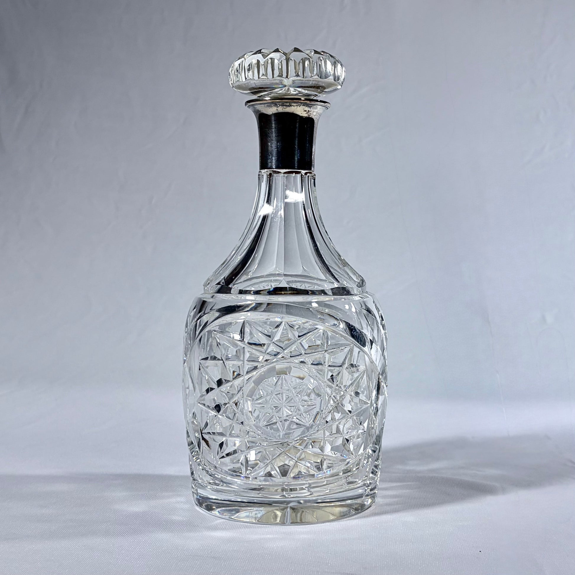 KLS Vaults 1936 George VI cut crystal decanter with sterling silver collar and intricate geometric diamond patterns.