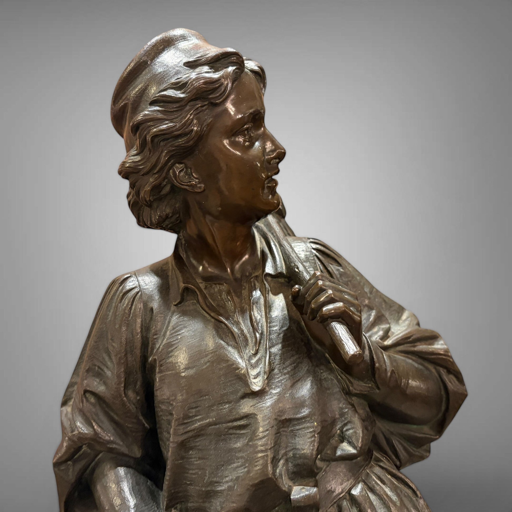 KLS Vaults 1873 patinated bronze sculpture of Dick Whittington by Charles Bell Birch, showing detailed tunic texture.