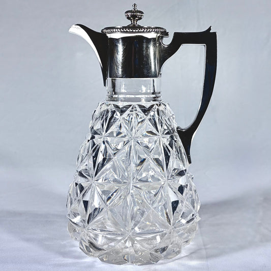 KLS Vaults Edwardian lead crystal claret jug with diamond-point cut glass and sterling silver mount, London 1902.