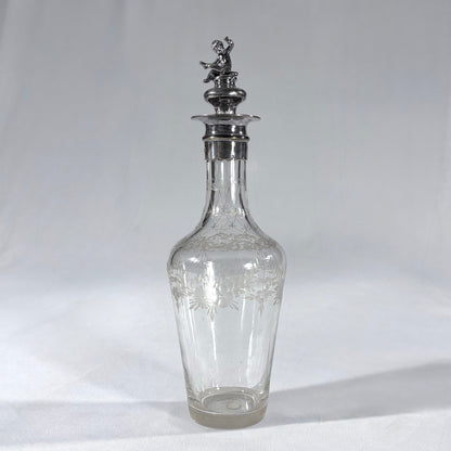 KLS Vaults Edwardian glass liqueur decanter with frosted floral etching and a sterling silver cherub stopper from 1902.