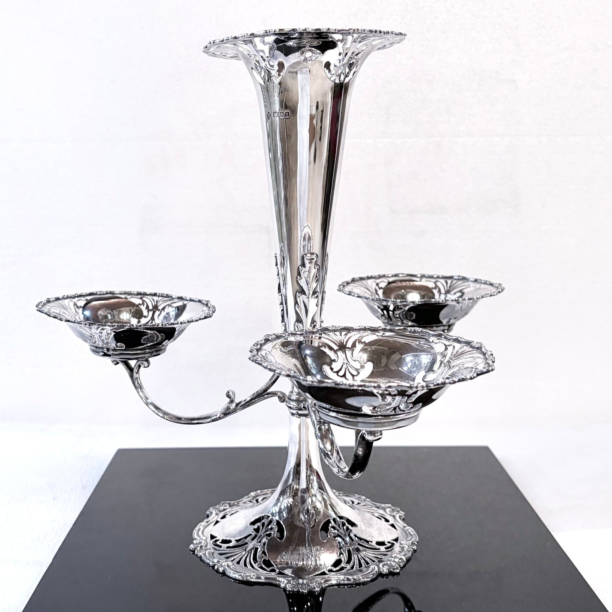 KLS Vaults Edwardian sterling silver epergne centerpiece with pierced foliate fretwork and three sweetmeat baskets.