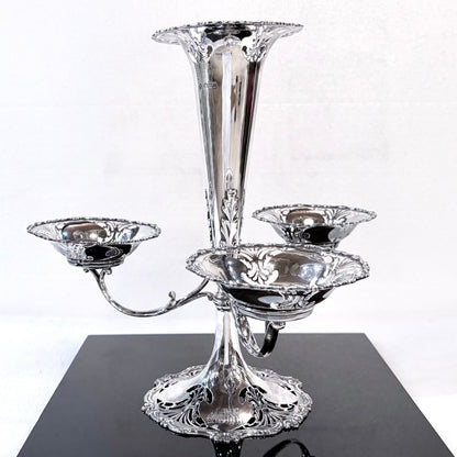 KLS Vaults Edwardian sterling silver epergne centerpiece with pierced foliate fretwork and three sweetmeat baskets.