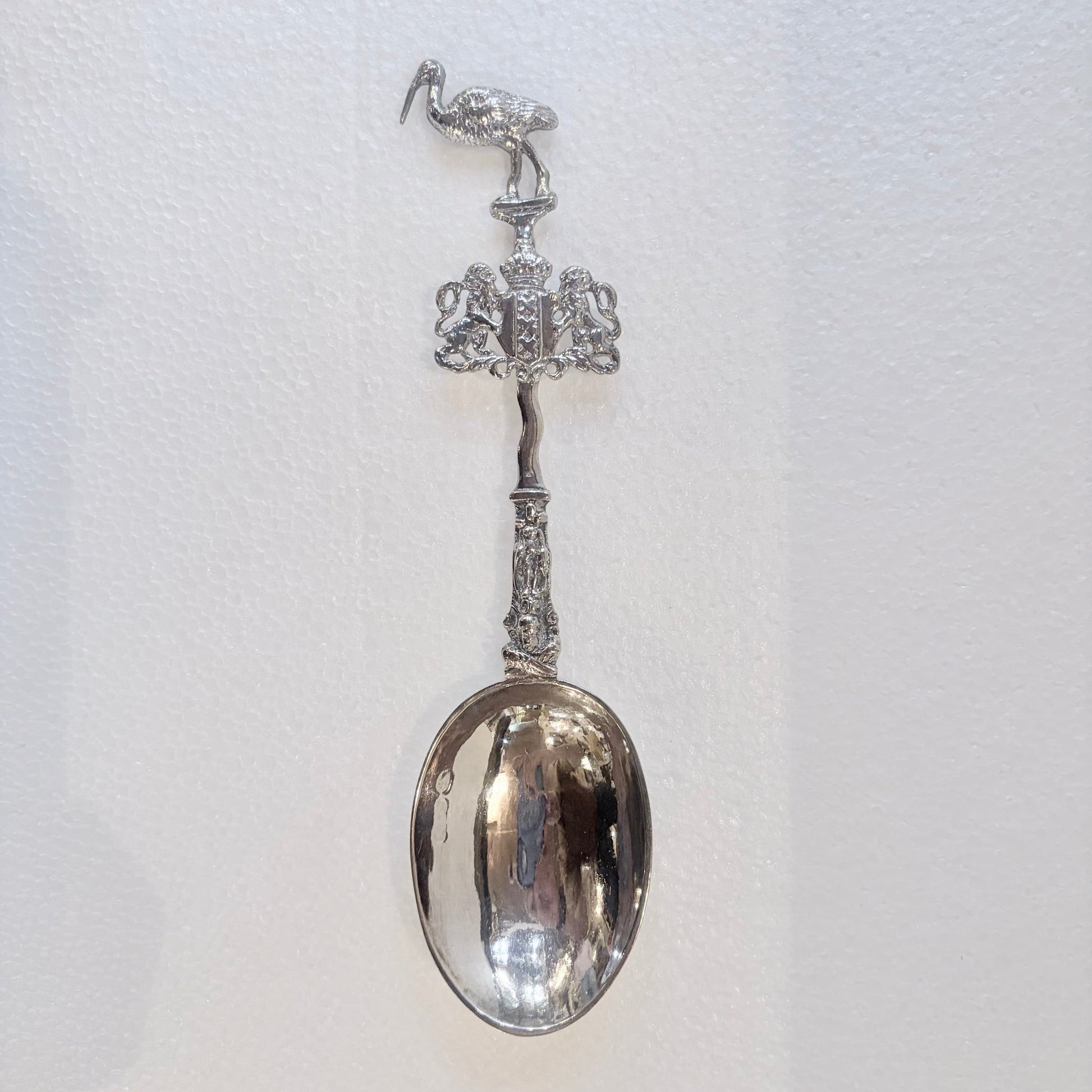 KLS Vaults 1902 Edwardian sterling silver marriage spoon with stork finial and ornate figural stem.