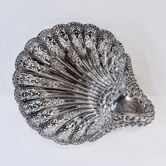 KLS Vaults Edwardian sterling silver shell-form centerpiece with intricate pierced panels and rococo scroll handle.