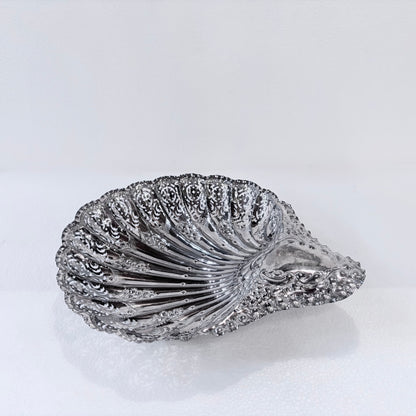 KLS Vaults Edwardian sterling silver shell-form centerpiece with intricate pierced panels and rococo scroll handle.