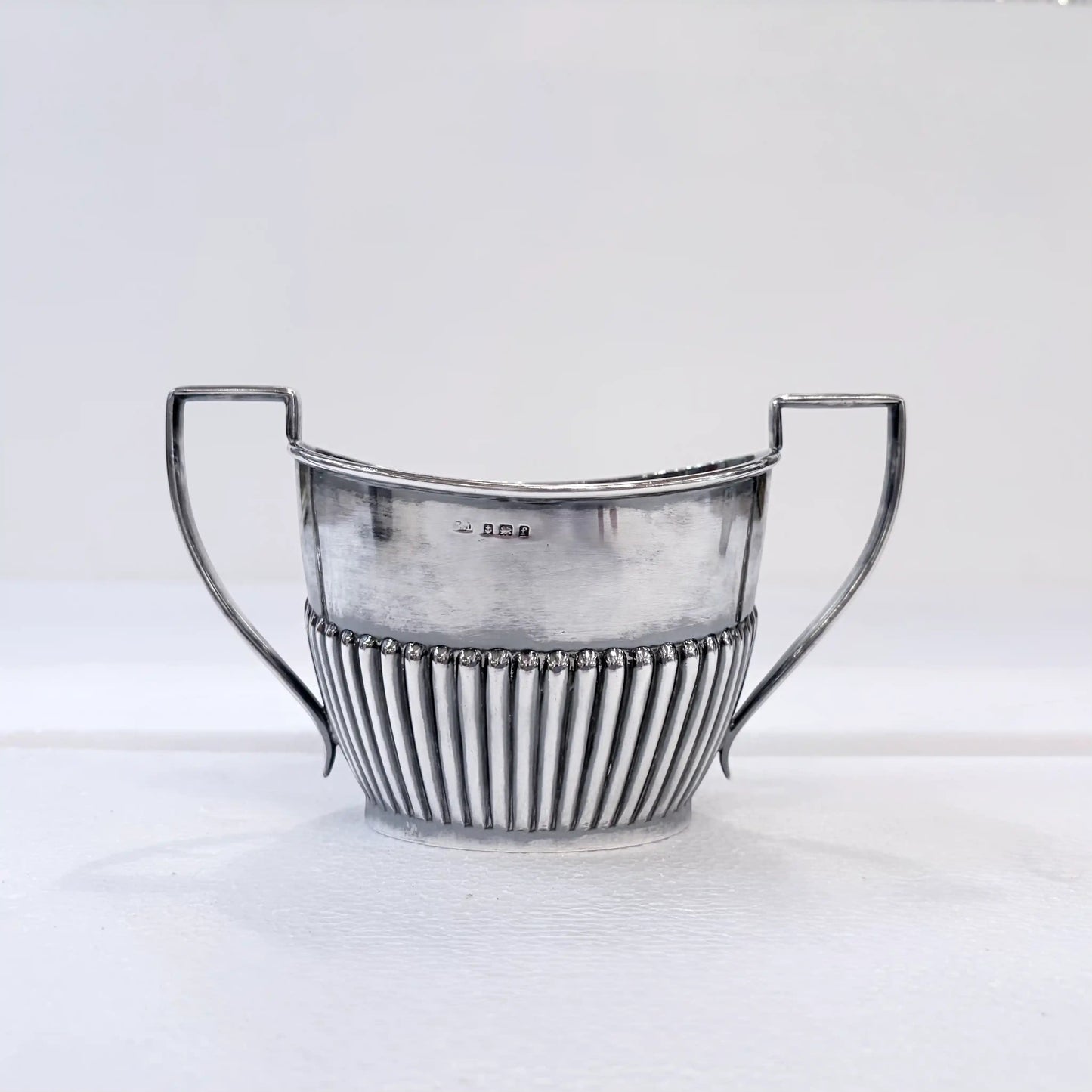 KLS Vaults Edwardian sterling silver sugar bowl with vertical gadrooned body and bead-and-reel border detail.