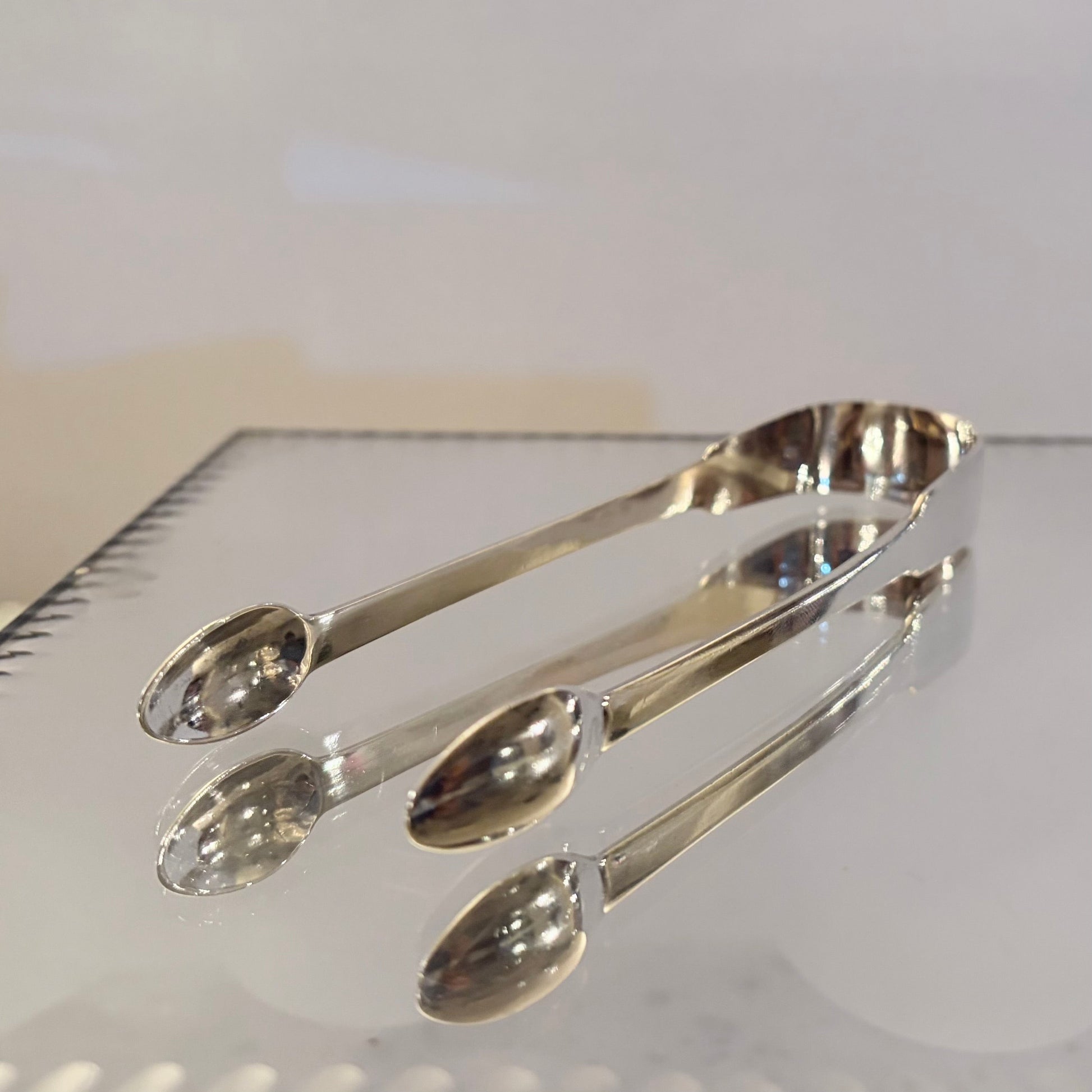 KLS Vaults George III sterling silver sugar tongs from 1807 with polished finish and engraved monogram