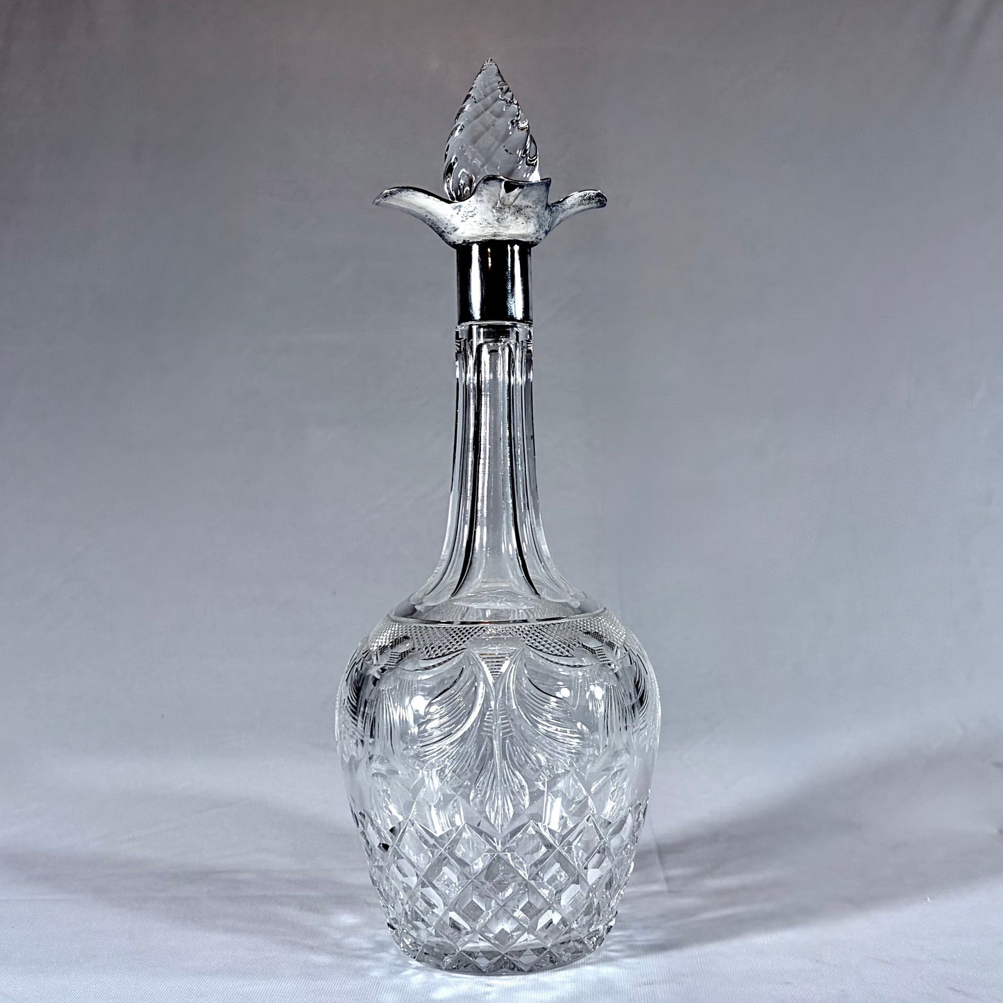 KLS Vaults 1929 George V lead crystal decanter with sterling silver mount, thistle stopper, and intricate cut glass.