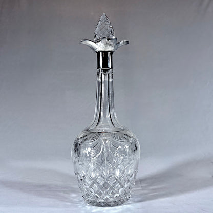 KLS Vaults 1929 George V lead crystal decanter with sterling silver mount, thistle stopper, and intricate cut glass.