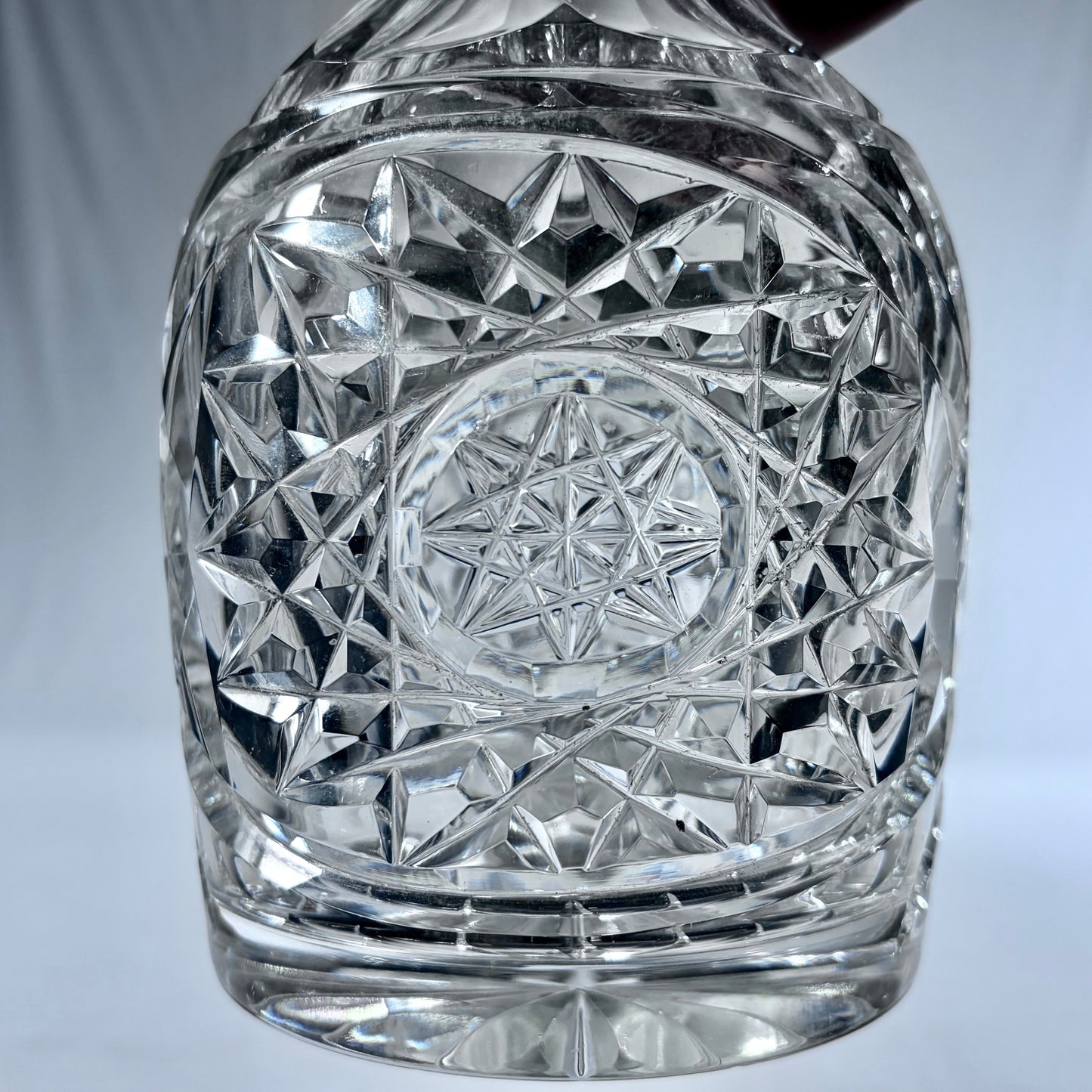 KLS Vaults George VI cut crystal decanter featuring intricate strawberry diamond and starburst geometric patterns.