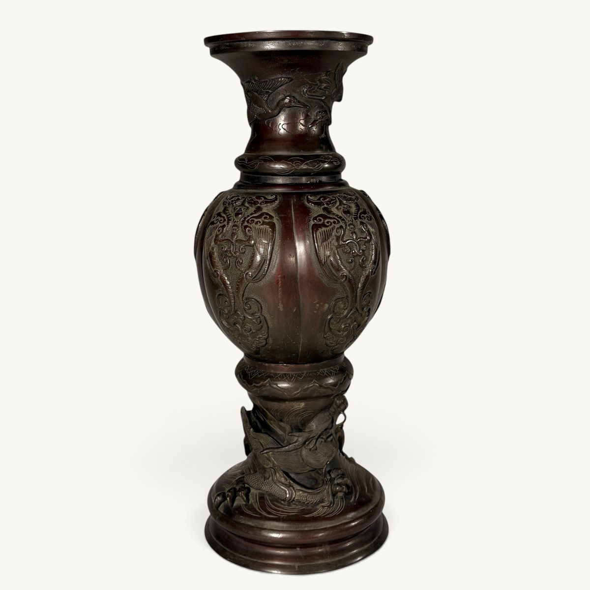KLS Vaults Japanese Meiji period bronze baluster vase featuring a sculpted dragon base and phoenix panels.