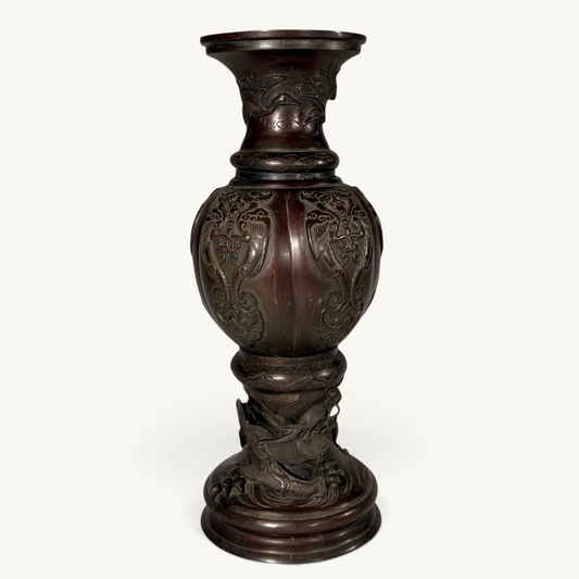 KLS Vaults Japanese Meiji period bronze baluster vase featuring a sculpted dragon base and phoenix panels.