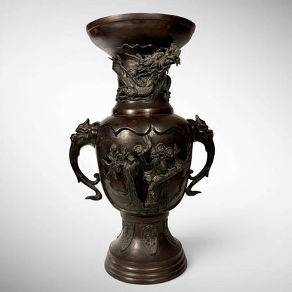 KLS Vaults antique Japanese bronze vase with high-relief dragon, phoenix, and shishi head handles in reddish-brown.